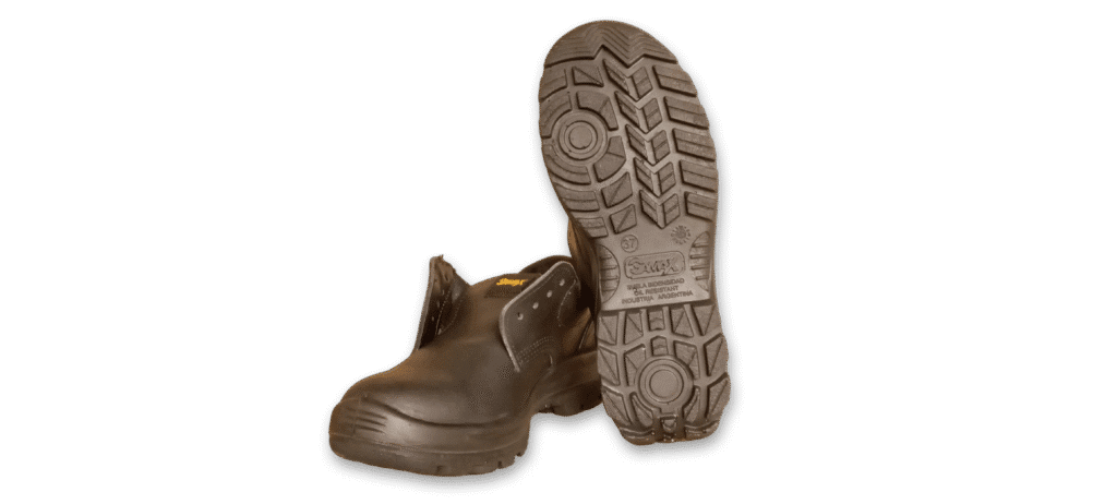 Zapato de seguridad GamaX, modelo 100A-100P, en color negro de cuero descarne, junto a la suela de otro zapato, mostrando el diseño de tracción.