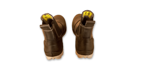 Par de botines de seguridad elásticos GamaX, modelo 108A-118P, en color negro, vistos de frente, destacando la punta de seguridad y la suela clara.